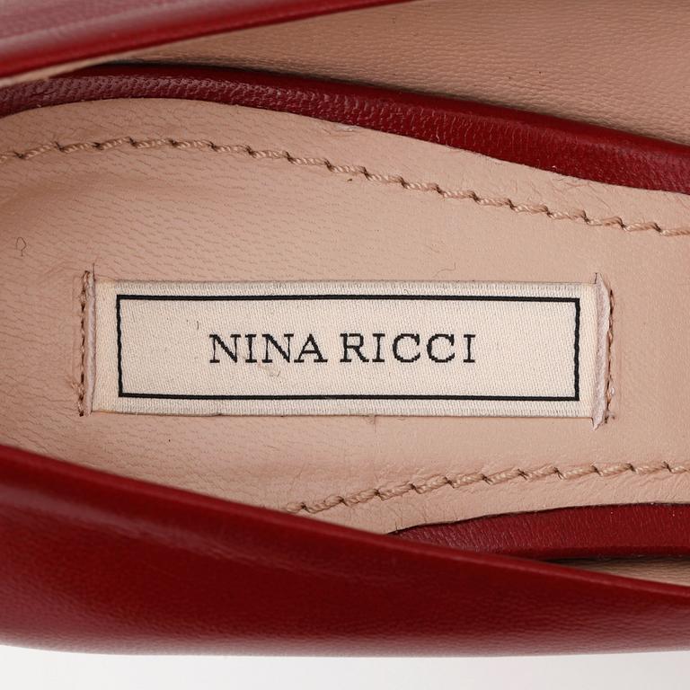 NINA RICCI, a pair of oxblood pumps, size 39.