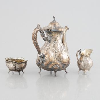 A silver coffee pot, creamer and sugar bowl, including GEWE, Malmö 1973. Rococo style.