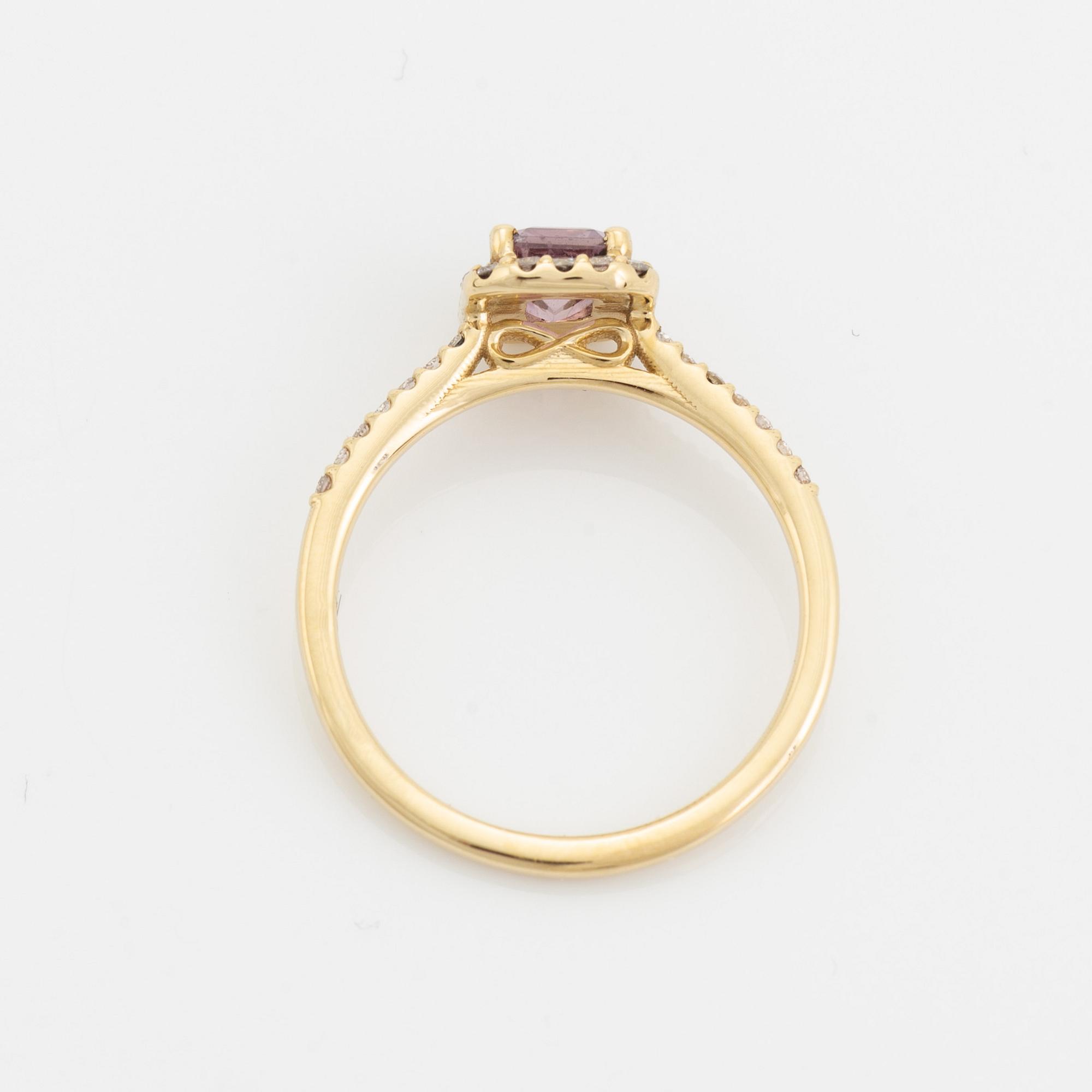 Emerald cut pink sapphire and brilliant cut diamond ring.