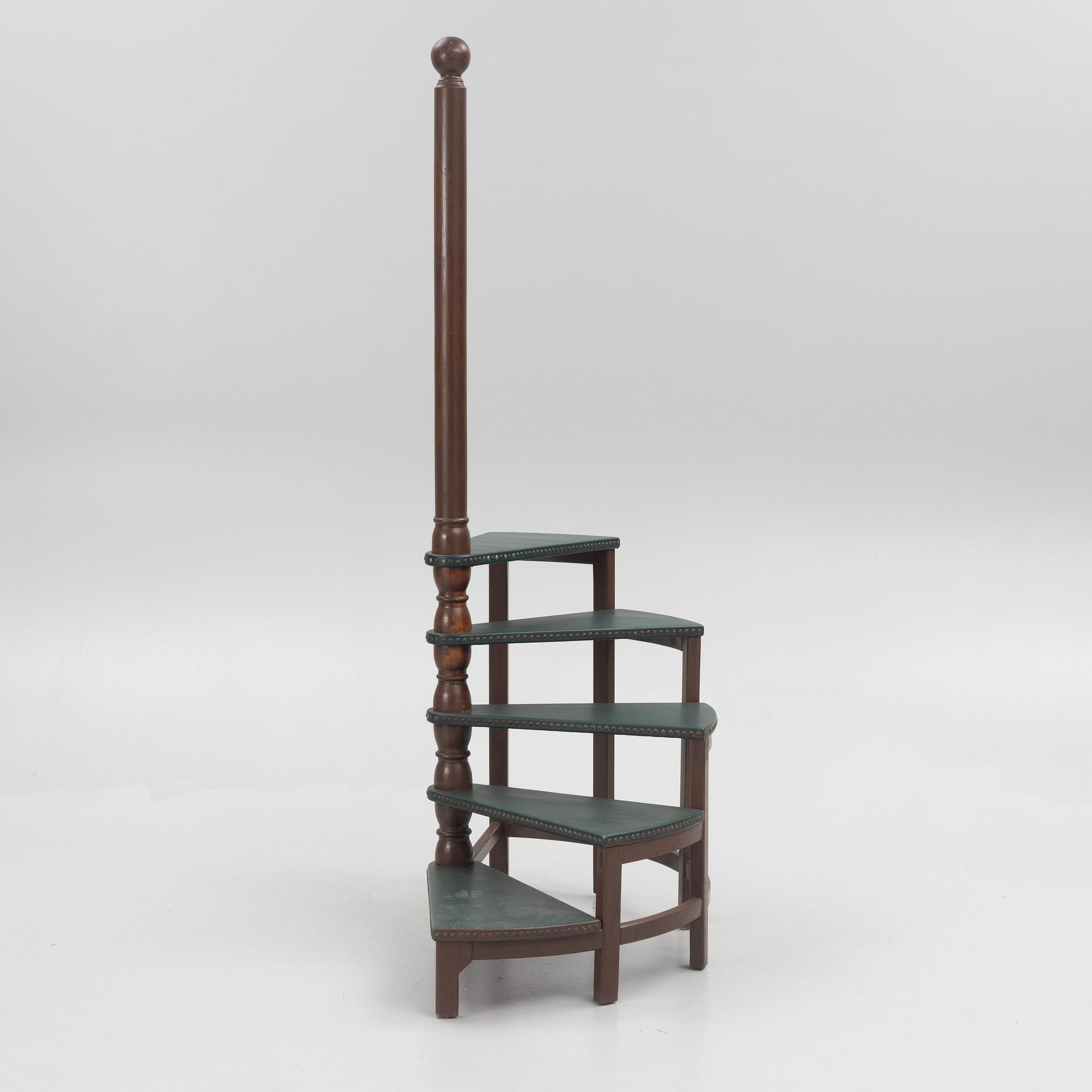 Amid 20th century library ladder.