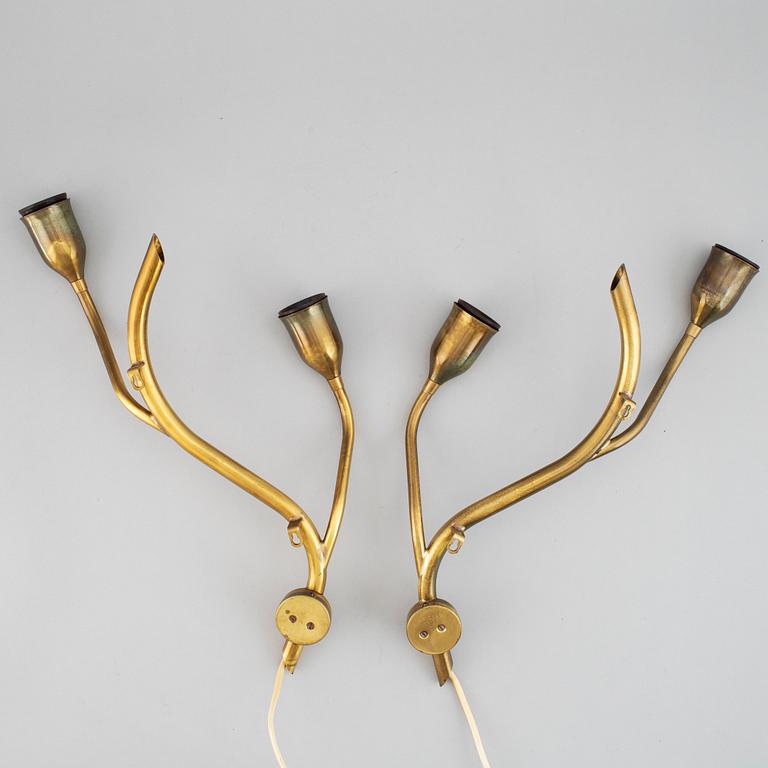 A pair of Astra brass wall lamps, mid 20th century.