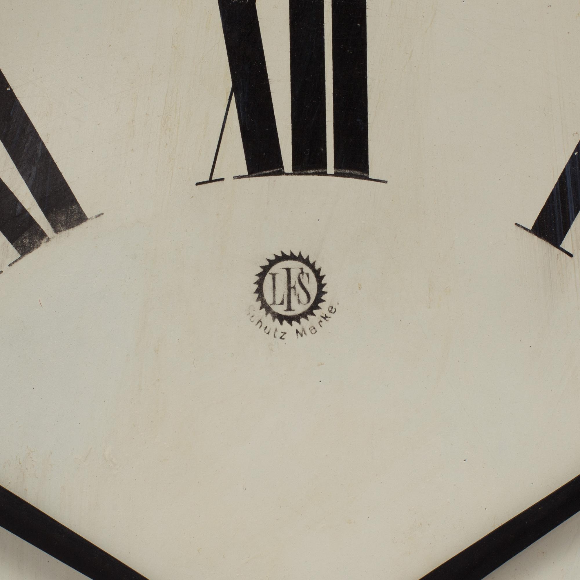 A 19th century wall clock marked LFS Schutz Marke, Germany.