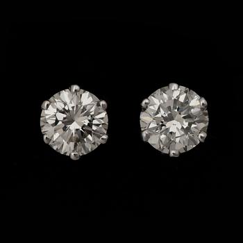 86. A pair of brilliant-cut diamond studs, total carat weight circa 2.04 cts.