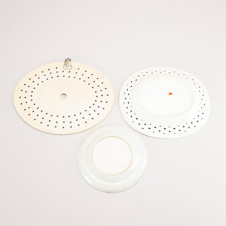 A set of two Chinese blue and white 18th century plates and strainer.