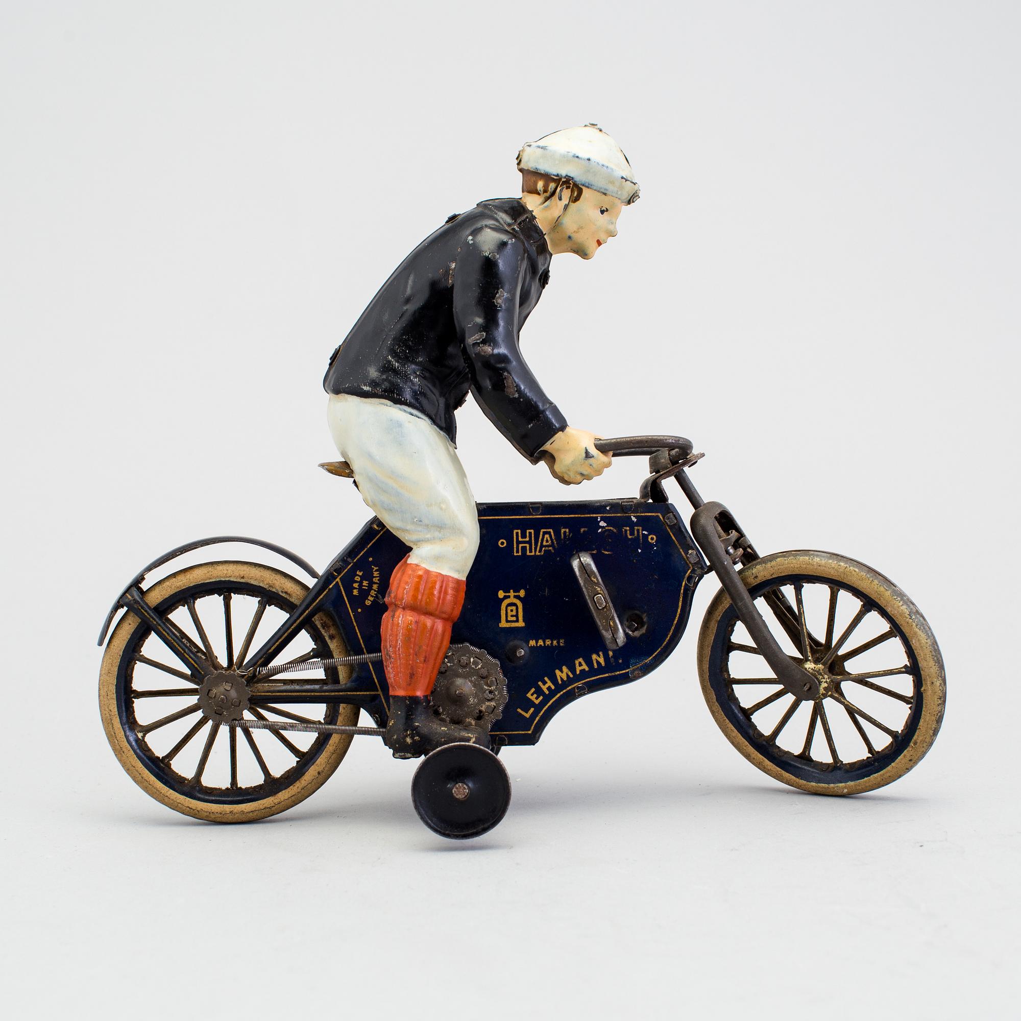 A partially hand painted tinplate Lehmann Halloh motorcycle, Germany. In production 1914-41.