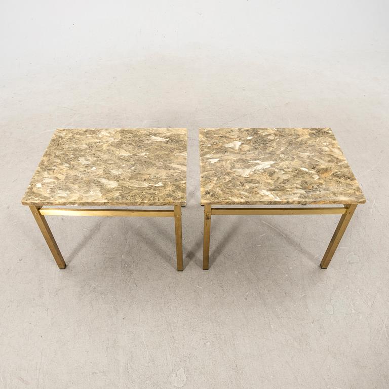 A pair of metal and stone side tables from the second half of the 20th century.