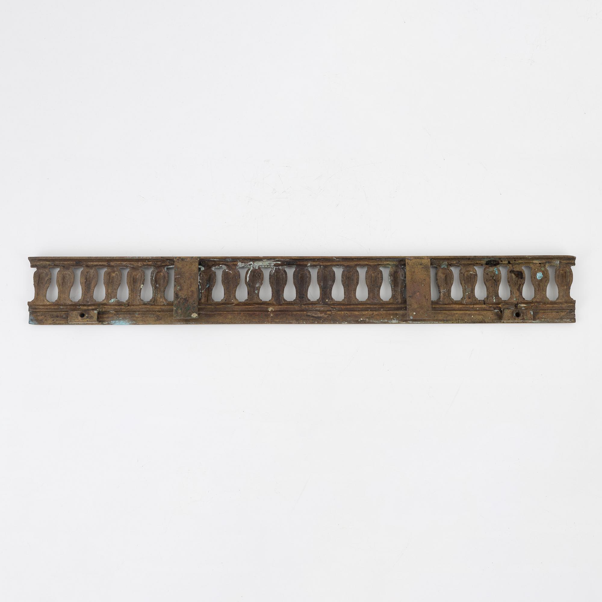 A Louis XVI style bronze grate, 19th Century.