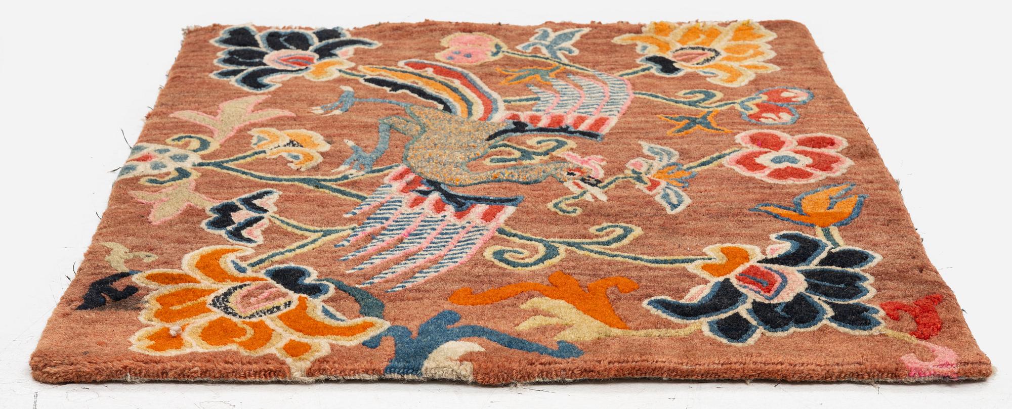 An antique 'Khagangma' rug, Tibet, around 1900. c. 74x63 cm.