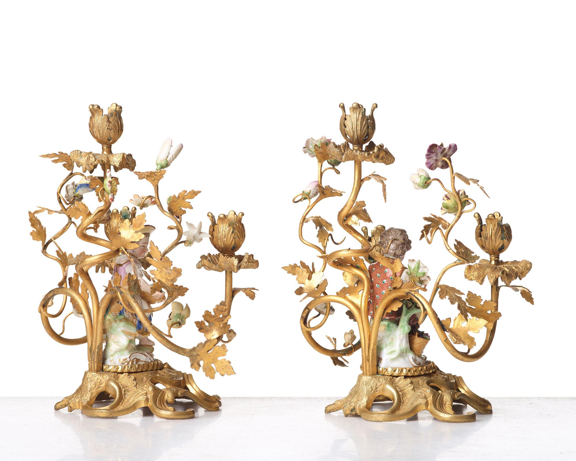 A pair of Meissen Rococo-style three-light candelabra, second half of the 1800's.