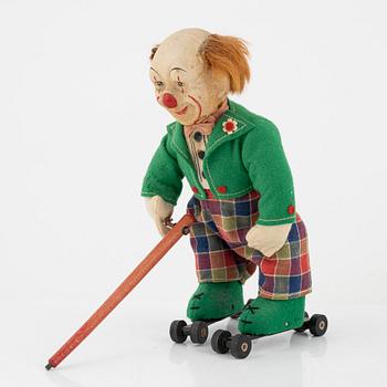 A set of five toys, including 'Rolly' clown from Schuco, 20th century.