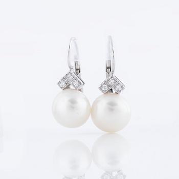 A pair of cultured pearl and ca 1.10 cts brilliant cut diamond earrings.