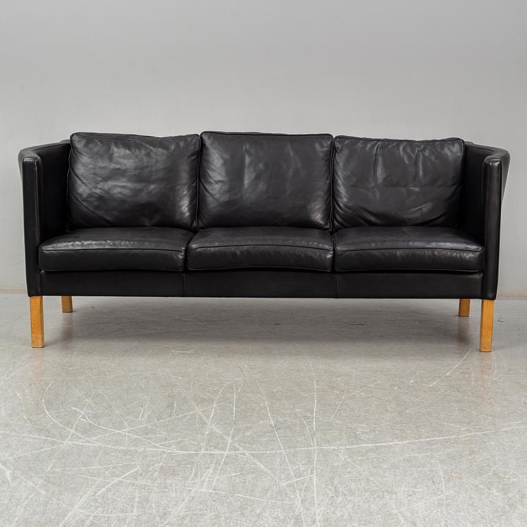 An 'AV59' sofa by Arne Vodder, Nielaus, Denmark.