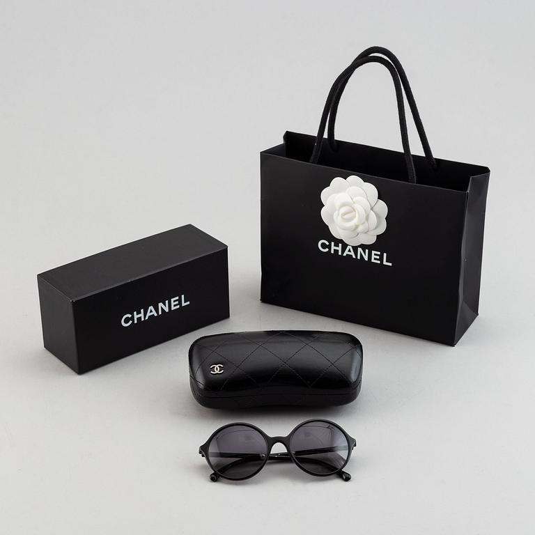 Chanel, a pair of sunglasses.