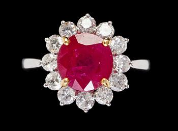 933. RING, rubin samt briljantslipade diamanter, tot. ca 0.70 ct.