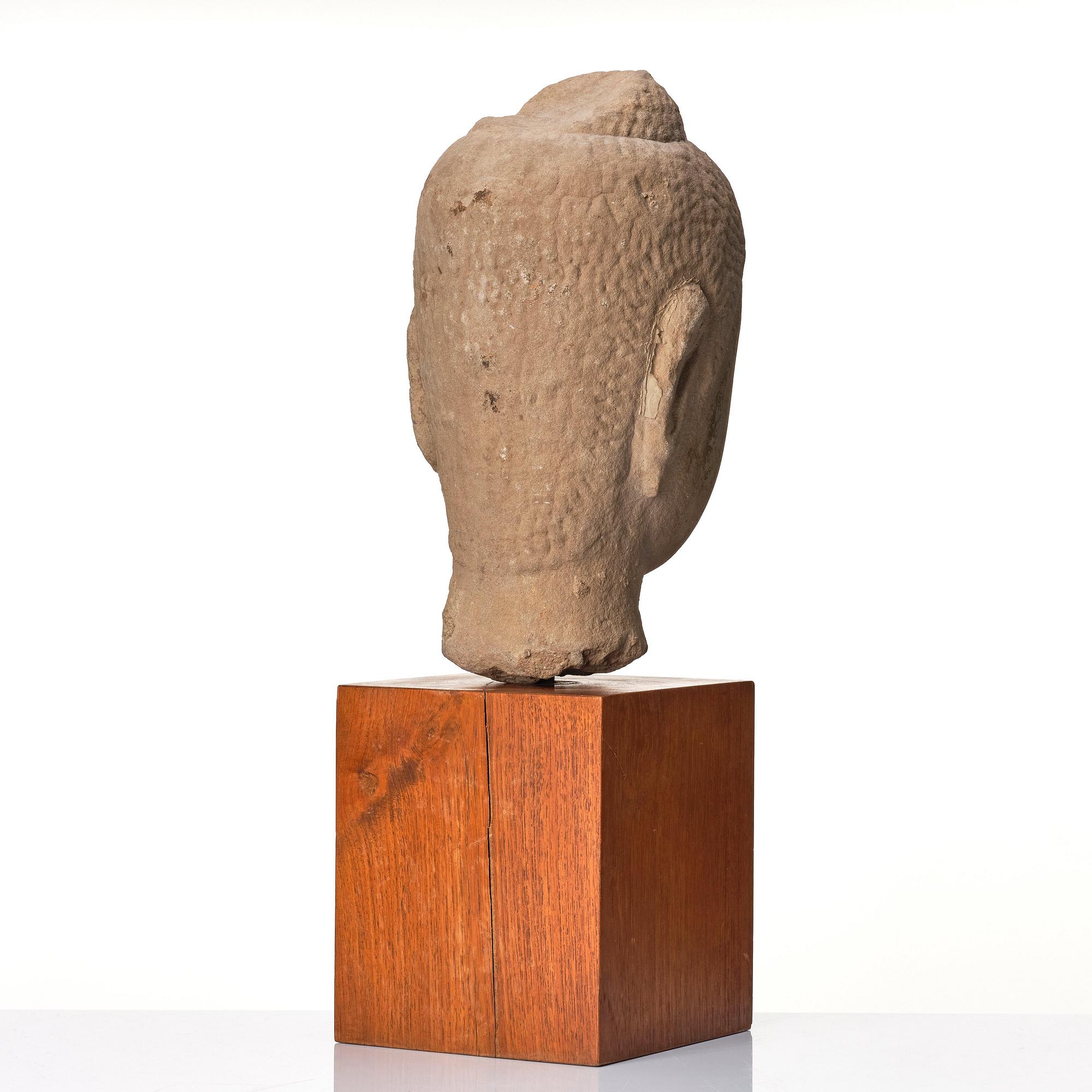 A sandstone head of Buddha Thailand, Ayutthayastyle, presumably 17th/18th century.