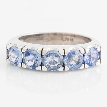 Ring with round faceted sapphires.