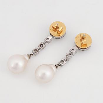 Brilliant-cut diamond and pearl earrings.