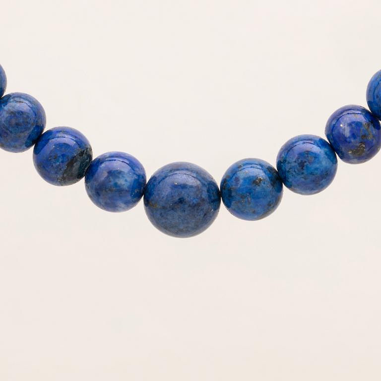 A set of lapis lazuli earrings and necklace.