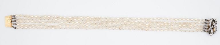 A five strand natural saltwater pearl necklace.