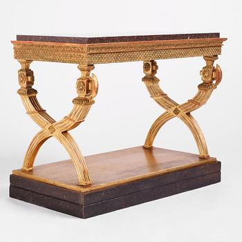 An Empire giltwood and 'Blyberg' porphyry console in the manner of J. Frisk, Stockholm early 19th century.