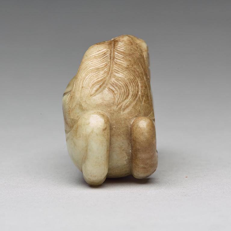 A carved nephrite figure, Ming dynasty (1368-1644).