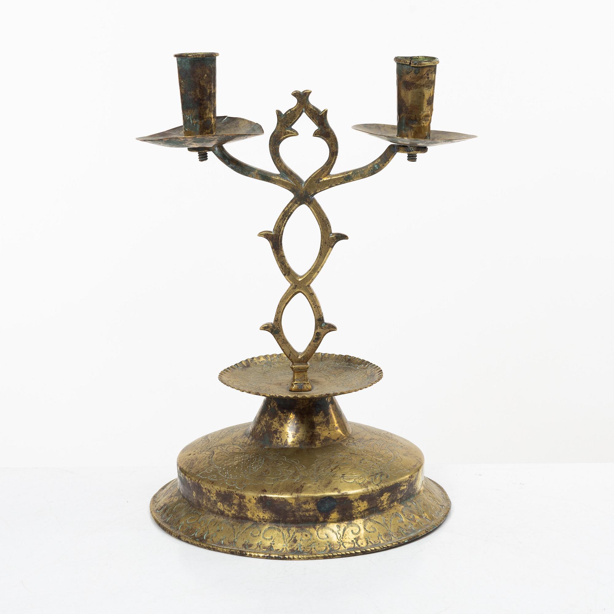 A Swedish brass two-branch candlestick, 18th/first part 19th century.