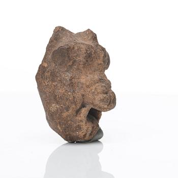 A pottery sculpture of a Roman/Greek satyrs head, presumably 5th - 2nd Century B.C.