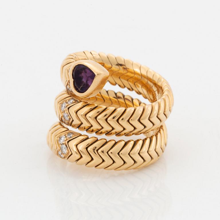 A Bulgari "Spiga" 18K gold ring set with an amethyst and round brilliant-cut diamonds.