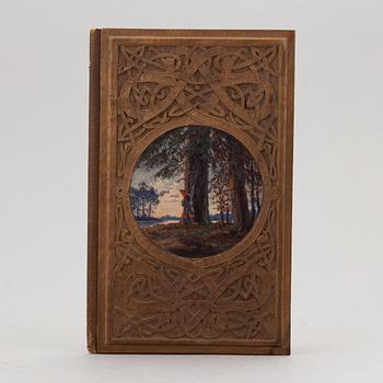 A keepsake book embellished by Ellen Jolin featuring a 'Santa Claus' figure.
