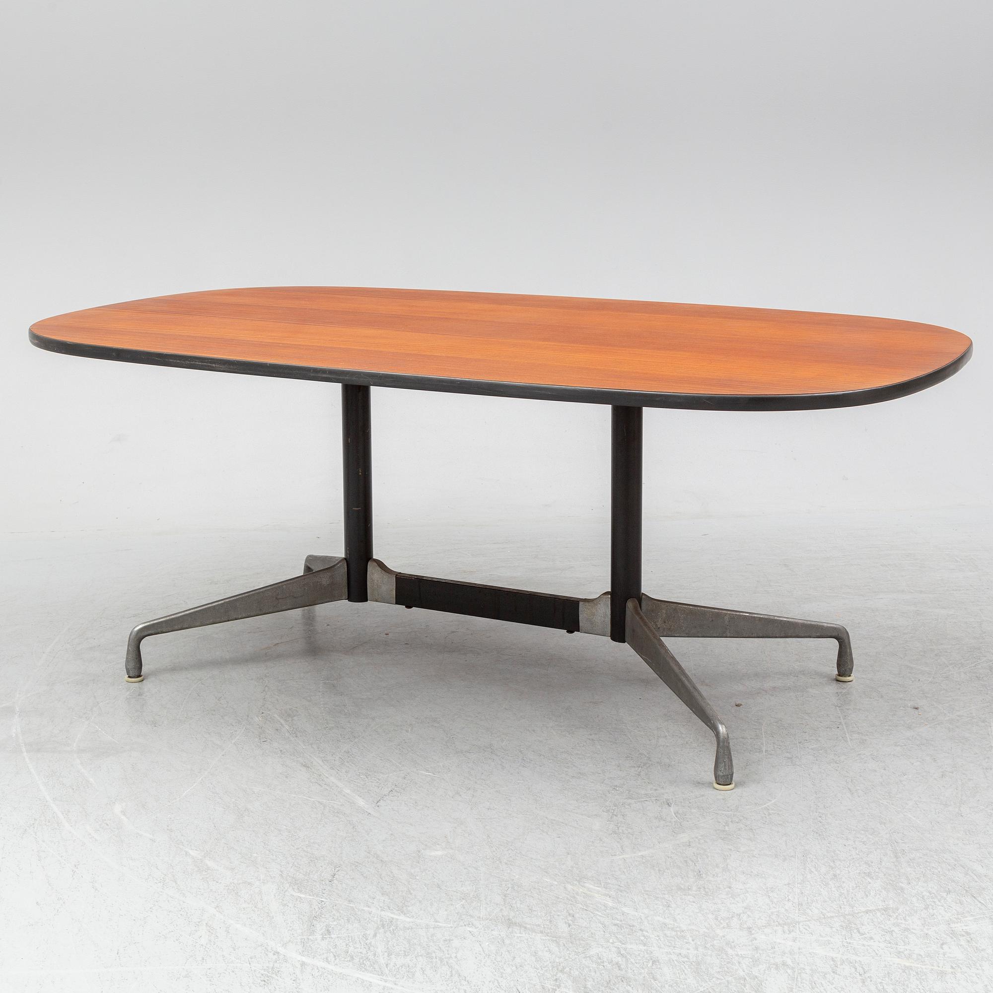 CHARLES AND RAY EAMES, a mahogany veneered table, Herman Miller.