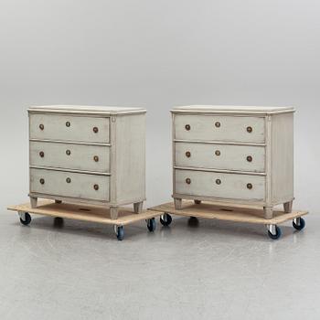 A pair of painted late gustavian-style chest of drawers.