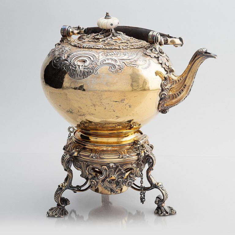 An English silver-gilt teapot with stand and burner, mark of Richard Sibley I, London 1825.