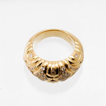 An 18K gold ring set with round brilliant-cut diamonds, London.