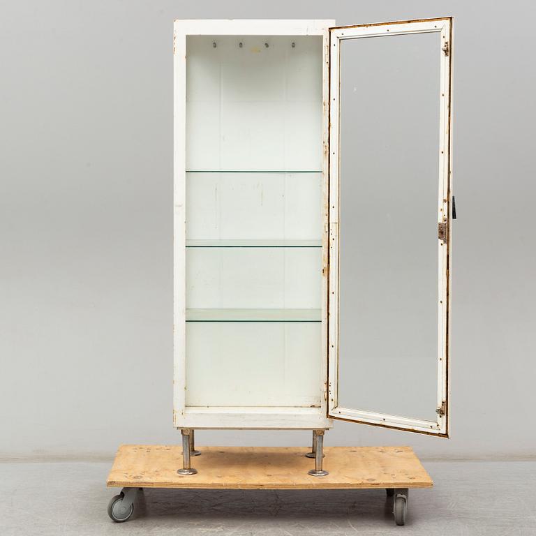 A metal doctor's cabinet, mid 20th century.