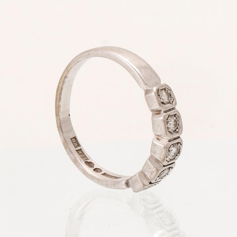 An 18K white gold half eternity ring set with round brilliant-cut diamonds.