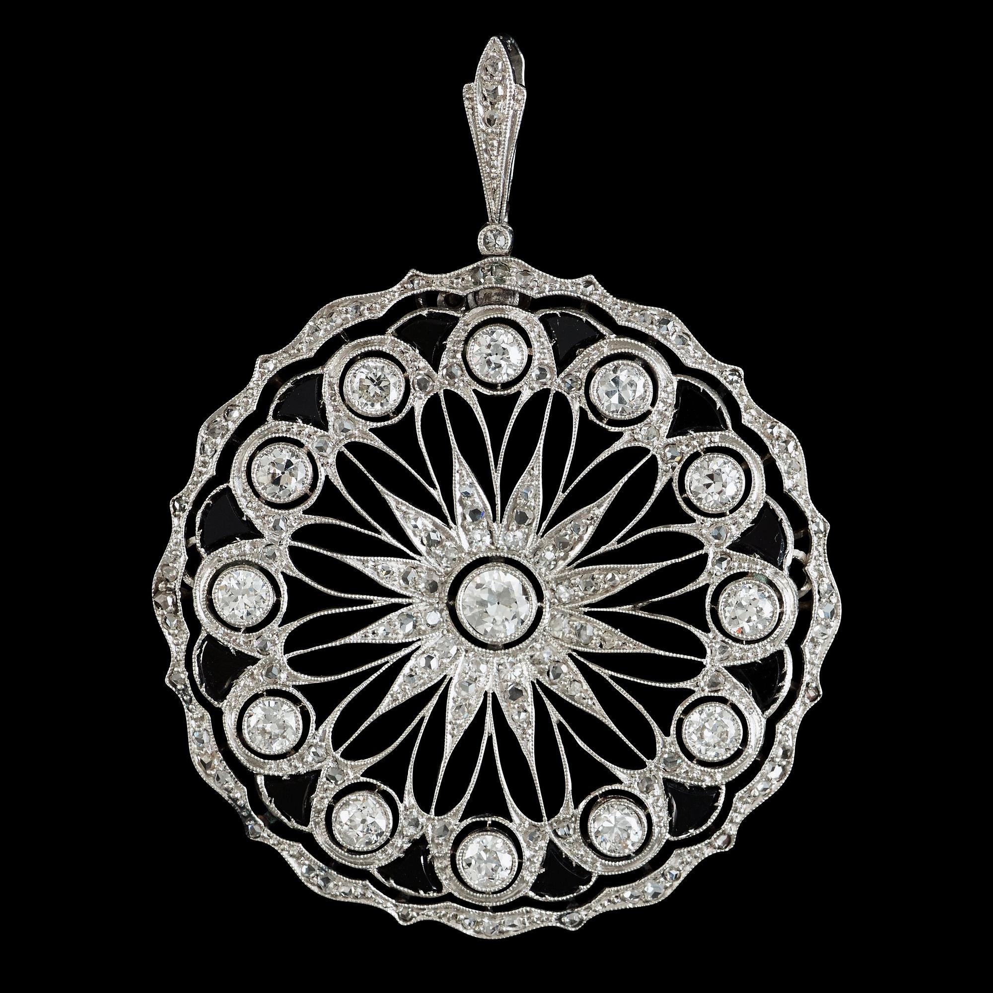 An onyx and old-cut diamond pendant. Total carat weight circa 1.50 cts.