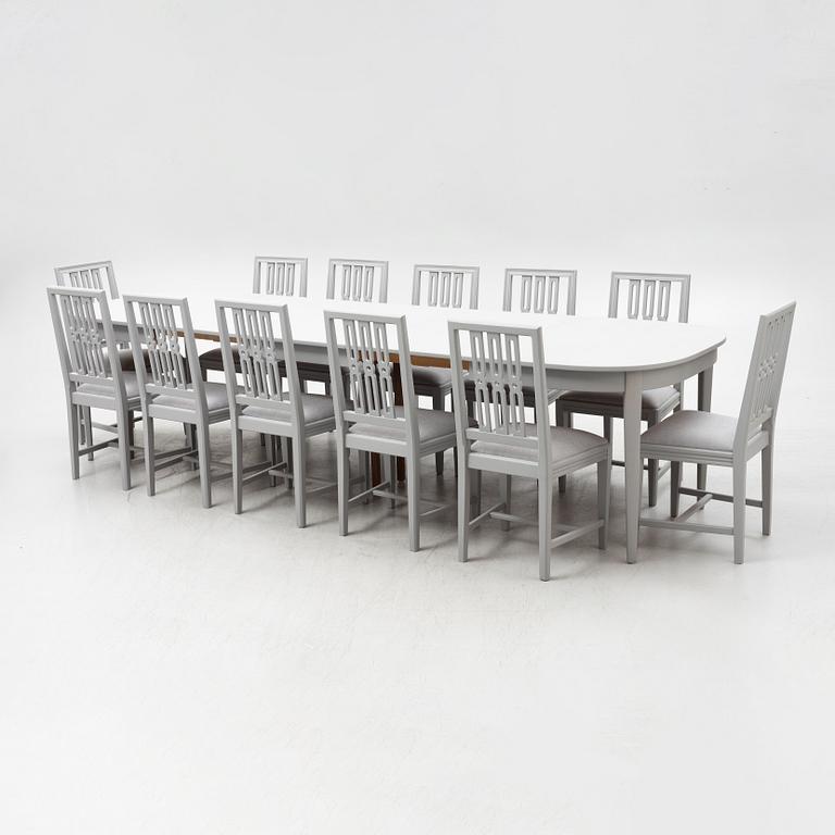 A Gustavian style dining table with twelve chairs, late 20th century.