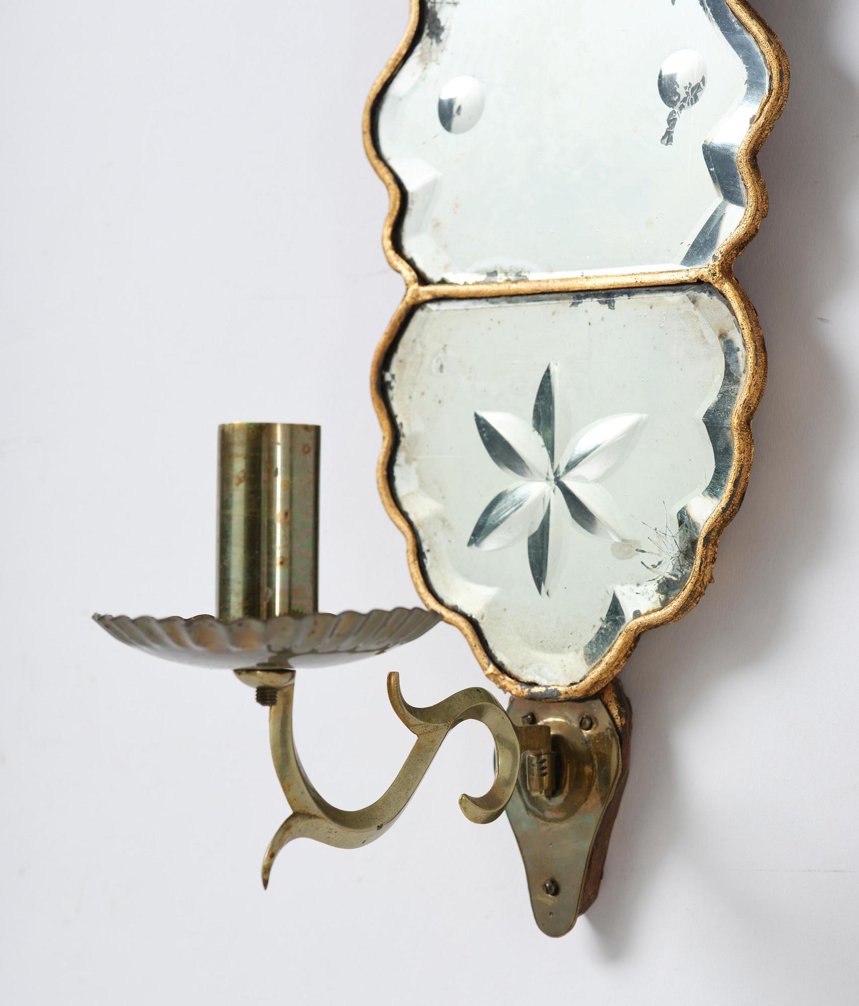 A pair of Swedish late Baroque one-branch girandole mirrors, mid 18th century.
