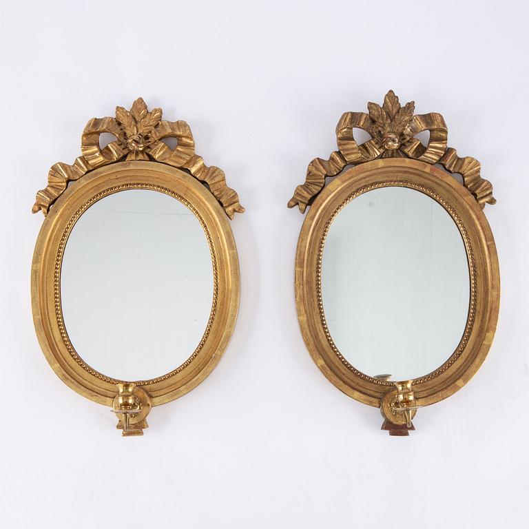 A pair of gilt Gustavian style mirror wall sconces, Stockholm, mid 20th Century.