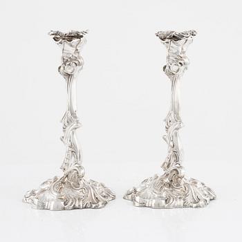 A pair of rococo style silver candle sticks by Pehr Fredrik Palmgren, Stockhom 1851.
