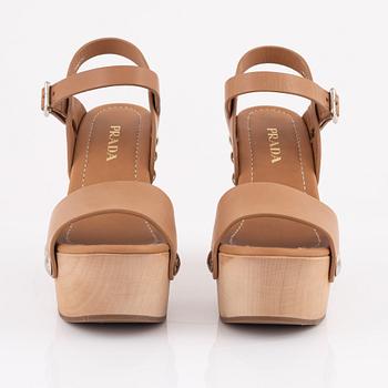 Prada, a pair of wood and leather sandals, size 37.