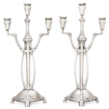 384. A pair of WMF Art Nouveau silver plated pewter candelabra, Germany.