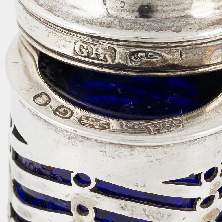 A pair of English salt and pepper shakers, silver and glass, London 1802-3, unidentified makers's mark.