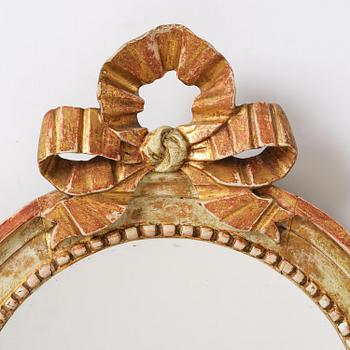 A pair of Gustaviantwo-branch giltwood girandole mirrors by C. G. Fyrwald (master in Stockholm 1776-1825).