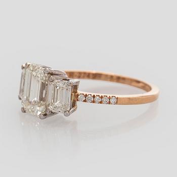 Ring, three baguette cut diamonds, small brilliant cut diamonds, 18K white gold and rose gold.