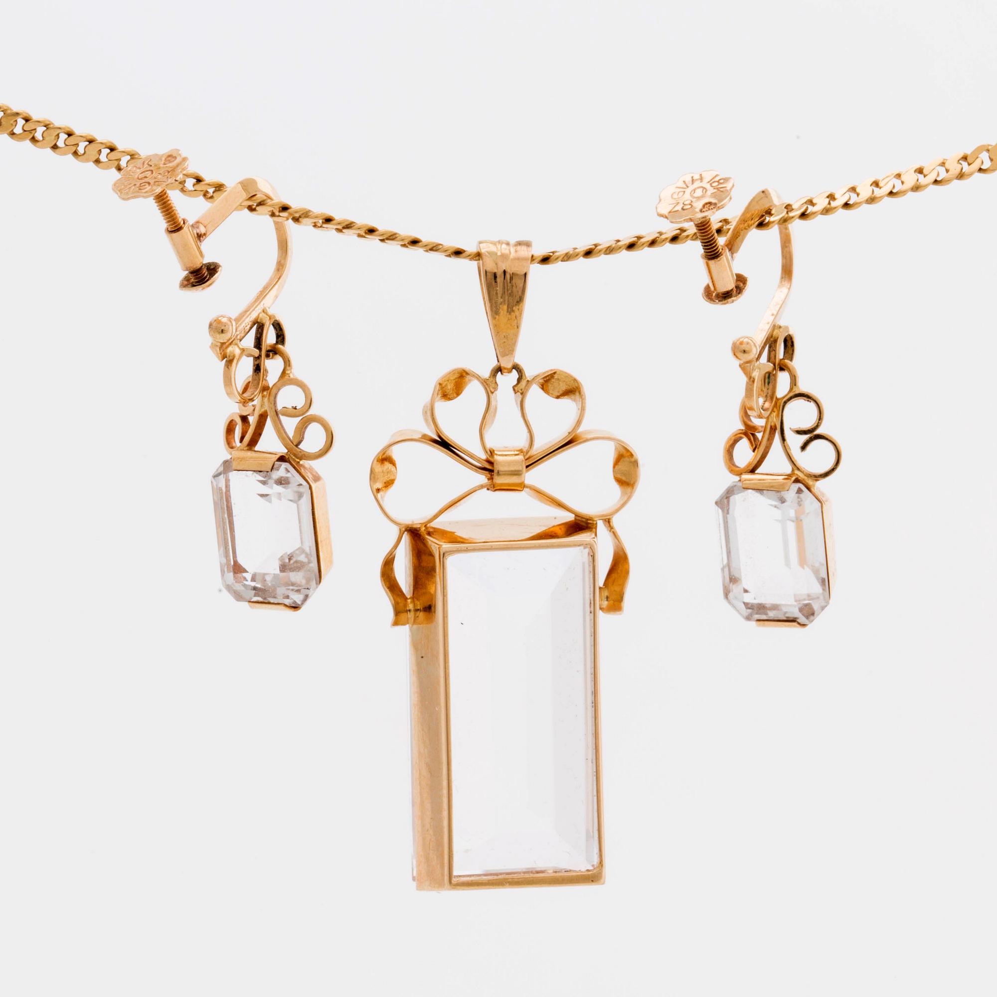 STIGBERT chainn and pendant and earrings, 18l gold and rock crystal.