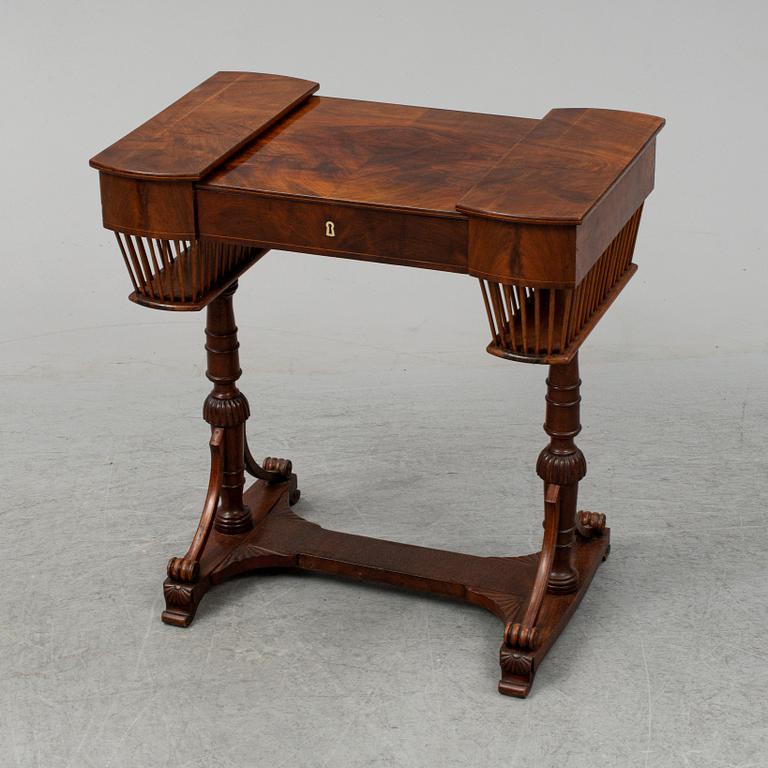 A sewing table, late Empire, 1830's.