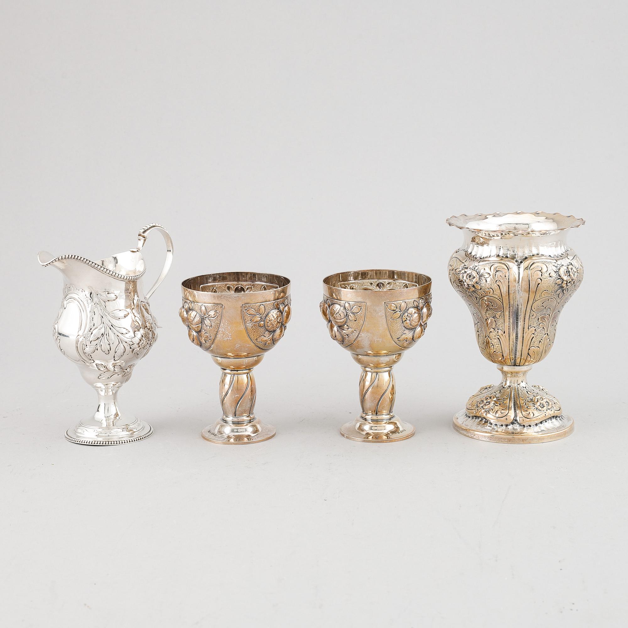 A mixed lot of two beakers, a vase and a jug, Baroque style, silver 830, 20th century.