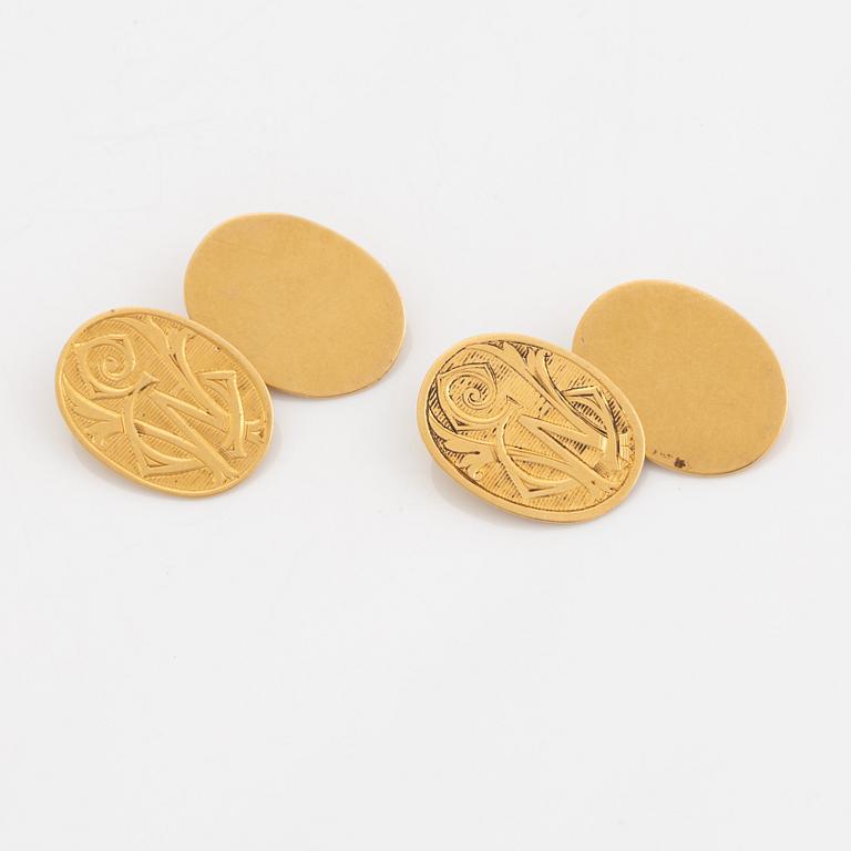 18K gold cufflinks with monogram.