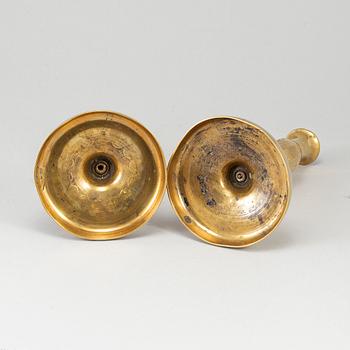 A pair of brass candlesticks, first half of the 19th century.